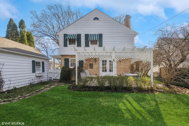 3916 Franklin Ave, Western Springs, IL 60558 - view of front of house featuring a chimney, a gate, a front lawn, brick siding, and fence