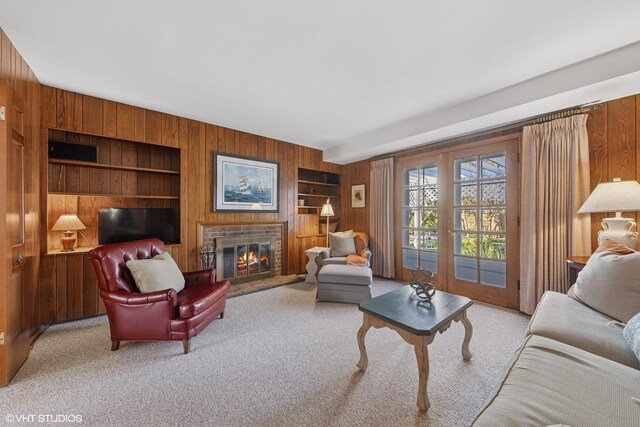 3916 Franklin Ave, Western Springs, IL 60558 - living room with built in features, wood walls, a fireplace, and carpet floors