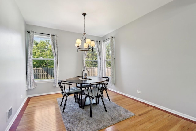 18485 W Springwood Dr, Grayslake, IL 60030 - dining space with a chandelier, baseboards, and light wood-type flooring