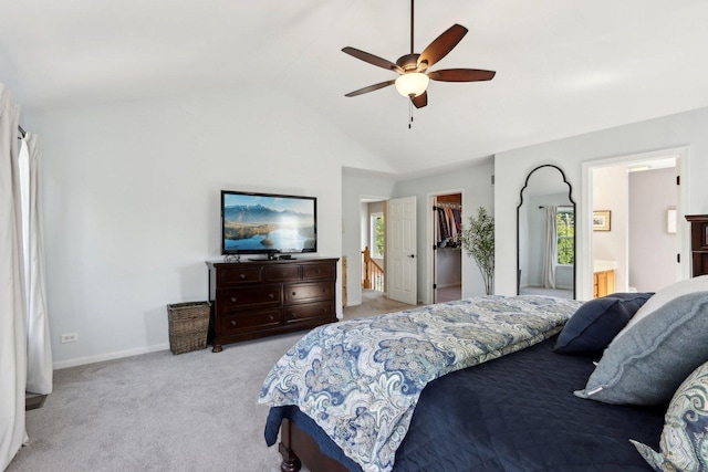 18485 W Springwood Dr, Grayslake, IL 60030 - bedroom with a walk in closet, light carpet, multiple windows, lofted ceiling, and ceiling fan