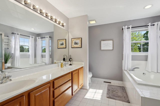 18485 W Springwood Dr, Grayslake, IL 60030 - bathroom featuring double vanity, a garden tub, tile patterned floors, baseboards, and toilet