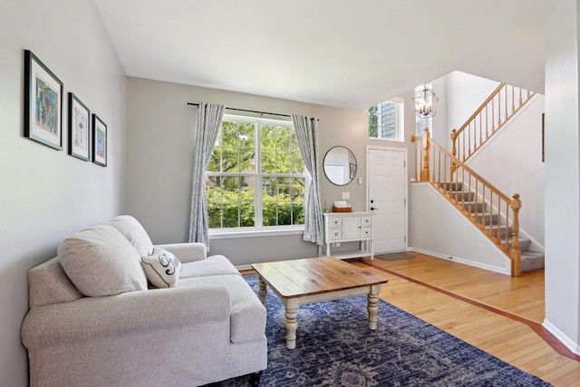 18485 W Springwood Dr, Grayslake, IL 60030 - living area with hardwood / wood-style flooring, a chandelier, stairway, and baseboards