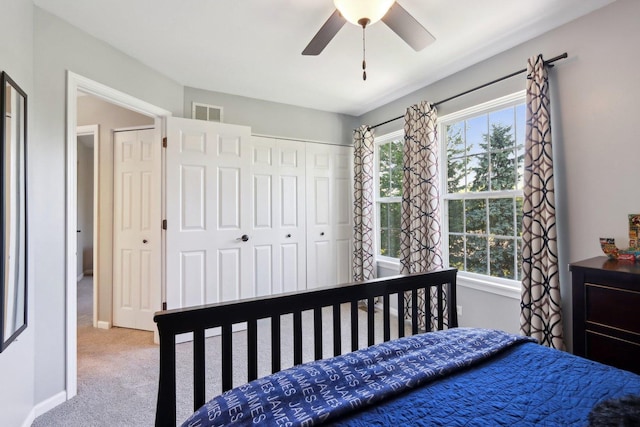 18485 W Springwood Dr, Grayslake, IL 60030 - carpeted bedroom with multiple windows, a closet, and a ceiling fan