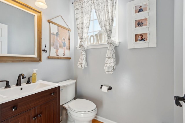 18485 W Springwood Dr, Grayslake, IL 60030 - bathroom featuring toilet, vanity, and baseboards