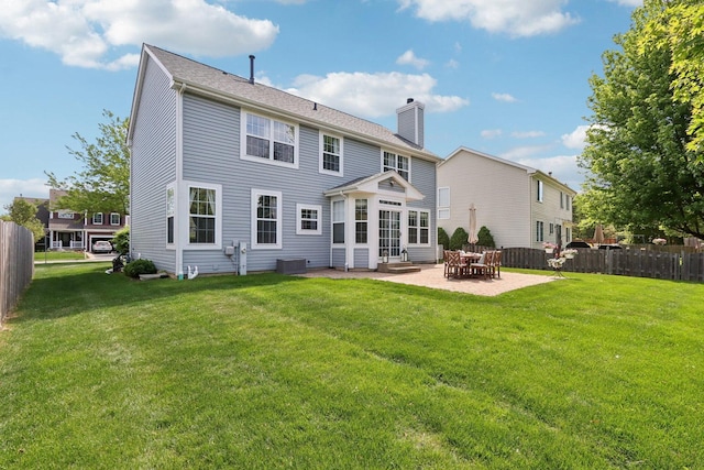 18485 W Springwood Dr, Grayslake, IL 60030 - rear view of house with a chimney, a patio, cooling unit, and entry steps