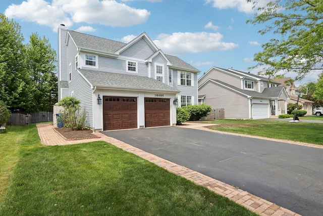 18485 W Springwood Dr, Grayslake, IL 60030 - view of front of property with a chimney, driveway, a garage, and a shingled roof