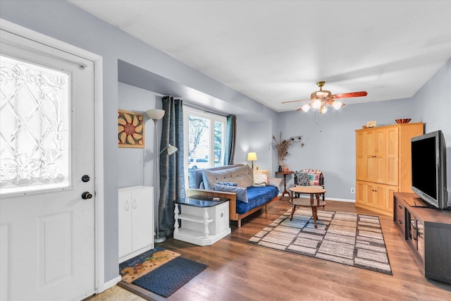 foyer entrance featuring a ceiling fan and light wood-style floors
