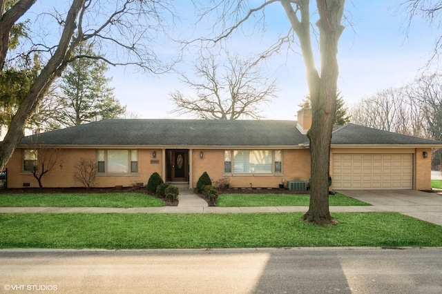 1131 S Hamlin Ave, Park Ridge, IL 60068 - single story home featuring an attached garage, concrete driveway, a chimney, a front lawn, and brick siding