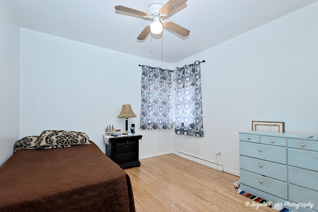 43 Lippincott Rd, Fox Lake, IL 60020 - bedroom featuring baseboards, light wood finished floors, baseboard heating, and ceiling fan