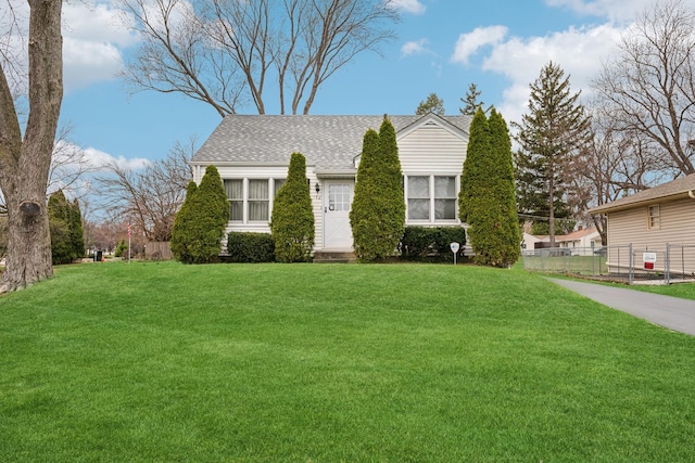 130 3rd St, Bloomingdale, IL 60108 - view of front of property with a shingled roof, fence, and a front lawn