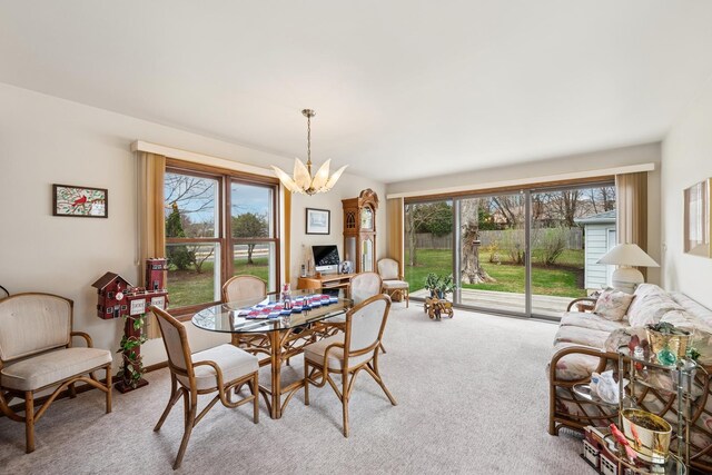 130 3rd St, Bloomingdale, IL 60108 - dining area featuring a chandelier and carpet