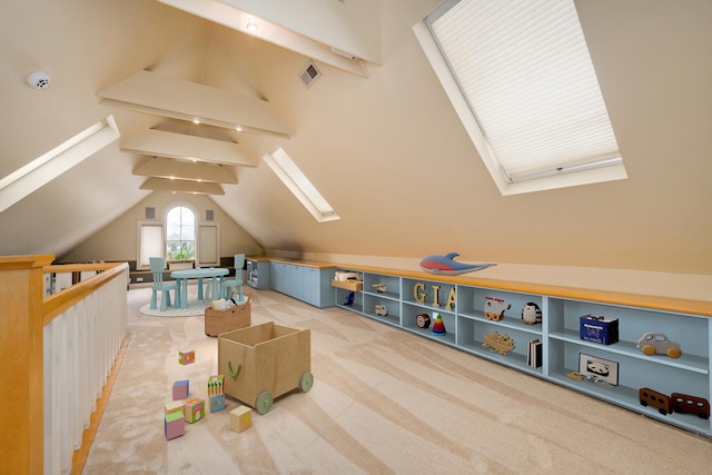 bonus room with vaulted ceiling with skylight, carpet flooring, and visible vents