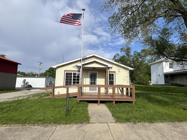 117 N Vermilion St, Potomac, IL 61865 - view of front of property with a front lawn and a wooden deck