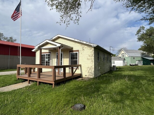 117 N Vermilion St, Potomac, IL 61865 - back of house featuring a lawn, a deck, and central AC unit