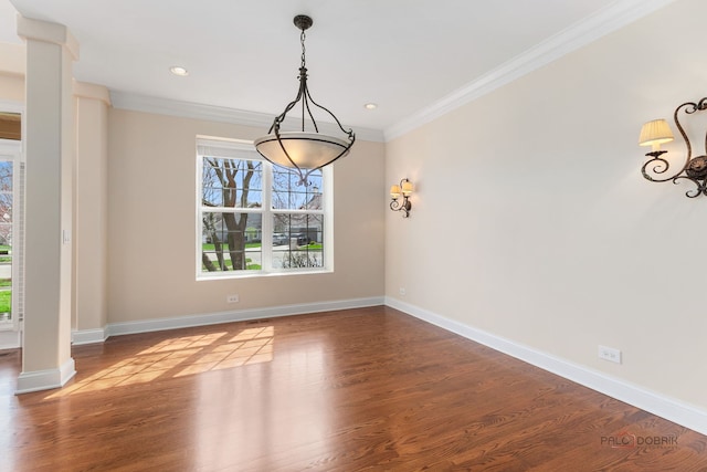 unfurnished dining area with wood finished floors, a healthy amount of sunlight, and ornamental molding