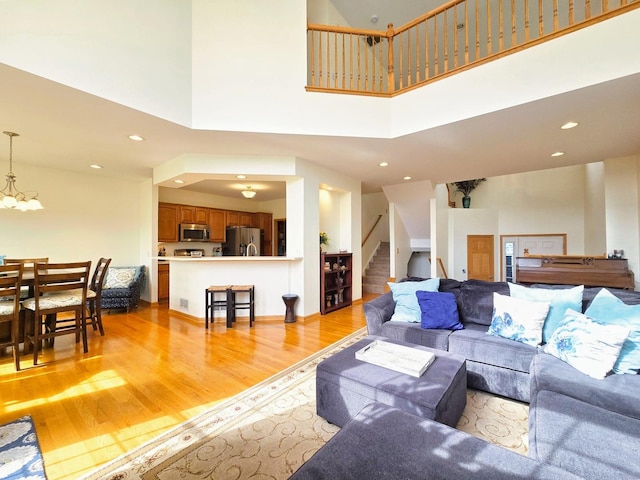 140 River Mist Dr, Oswego, IL 60543 - foyer entrance with wood finished floors, stairs, and recessed lighting