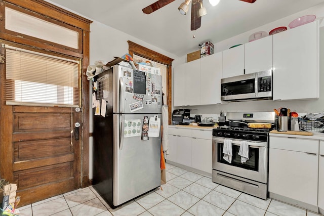 kitchen with white cabinetry, appliances with stainless steel finishes, light countertops, and a ceiling fan