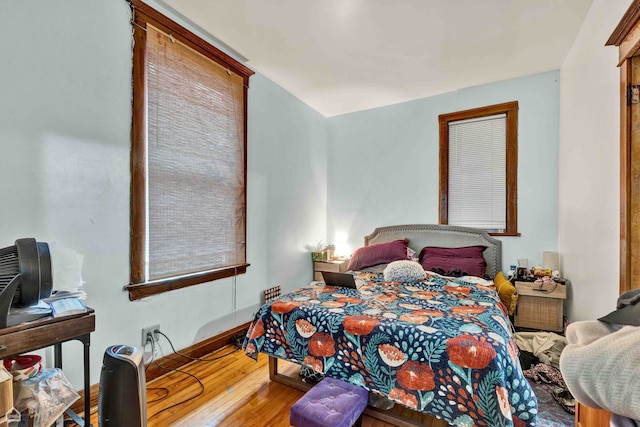 bedroom with hardwood / wood-style floors