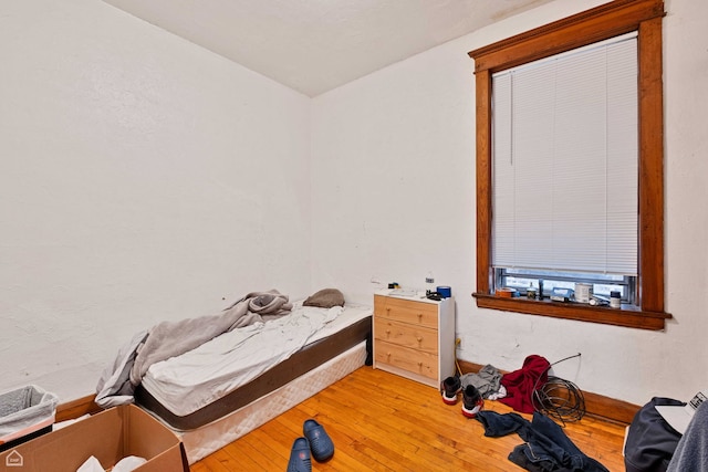 bedroom with light wood-style flooring