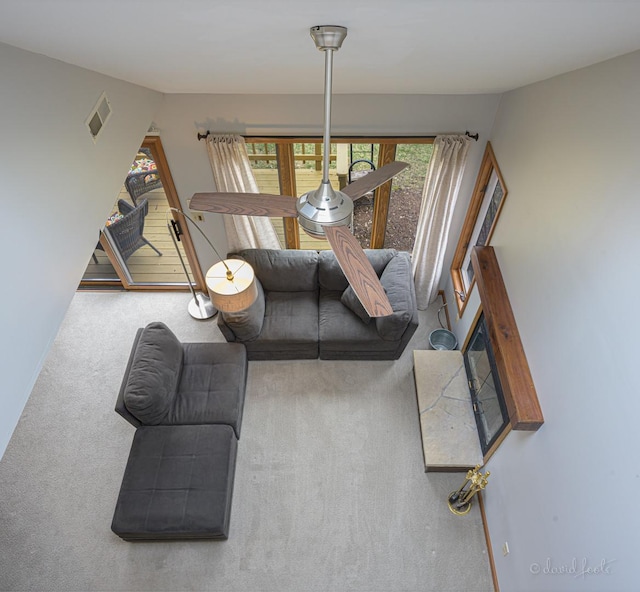 living room with visible vents and carpet floors