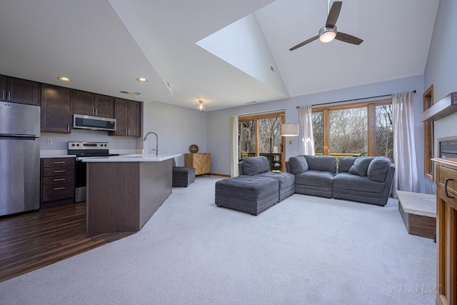 living room featuring dark colored carpet, a ceiling fan, lofted ceiling, and recessed lighting