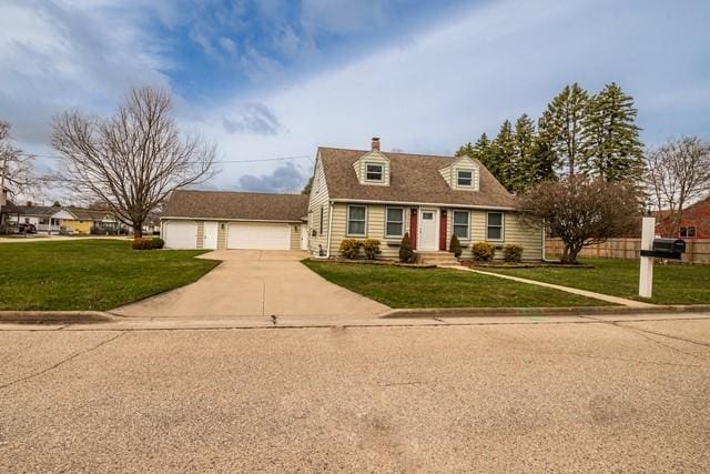 cape cod home with a front yard, a garage, a chimney, fence, and driveway