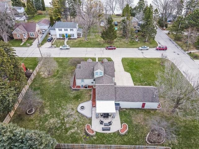 birds eye view of property with a residential view