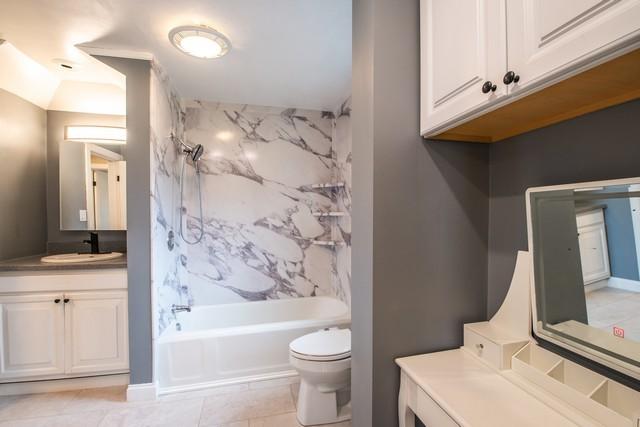 full bathroom with toilet, vanity, shower / bathing tub combination, and tile patterned flooring