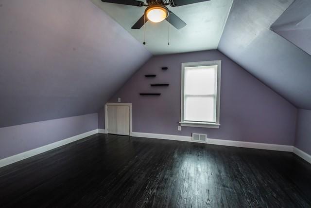 bonus room with lofted ceiling, baseboards, visible vents, ceiling fan, and wood finished floors