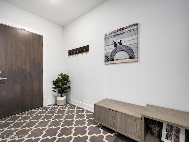 foyer entrance with baseboards
