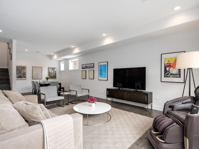 living room featuring wood finished floors, recessed lighting, baseboards, and stairway