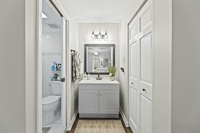 11212 Cottonwood Dr Unit 23A, Palos Hills, IL 60465 - bathroom with visible vents, toilet, and vanity