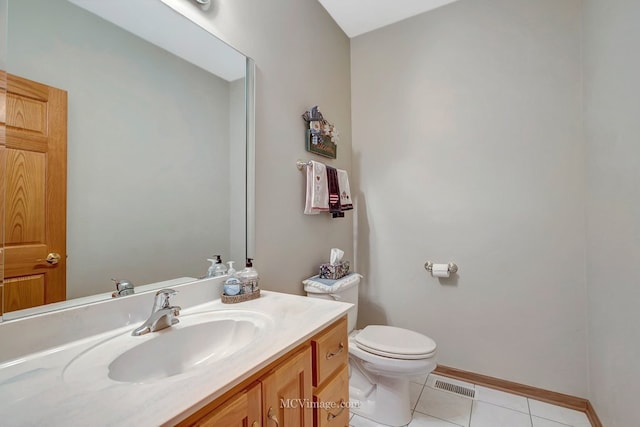 half bath featuring visible vents, baseboards, toilet, vanity, and tile patterned flooring