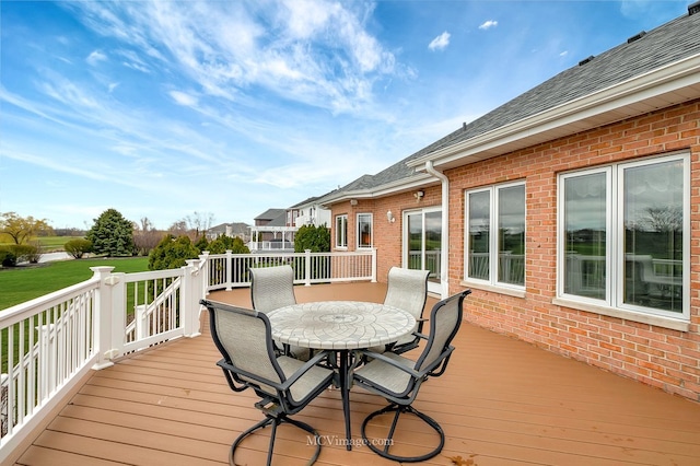 wooden deck featuring outdoor dining area