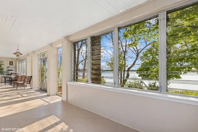 1046 N Hainesville Rd, Round Lake Beach, IL 60073 - unfurnished sunroom featuring plenty of natural light and a water view