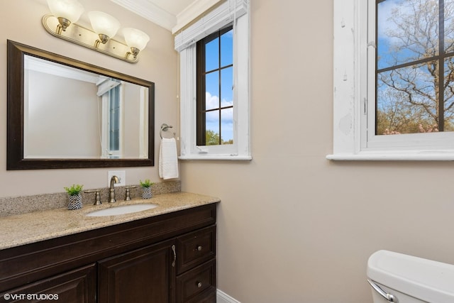 1046 N Hainesville Rd, Round Lake Beach, IL 60073 - half bath featuring crown molding, toilet, and vanity