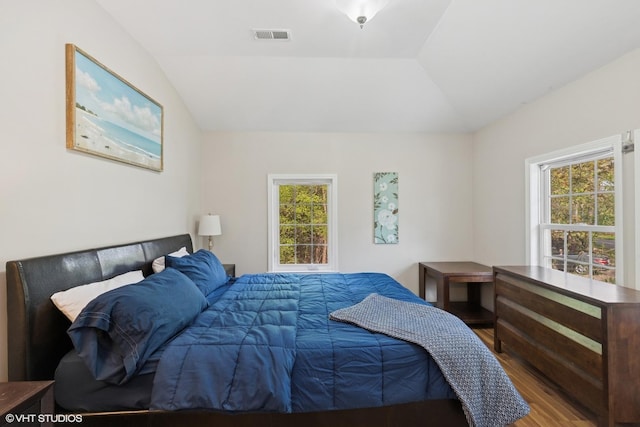 1046 N Hainesville Rd, Round Lake Beach, IL 60073 - bedroom featuring wood finished floors and vaulted ceiling