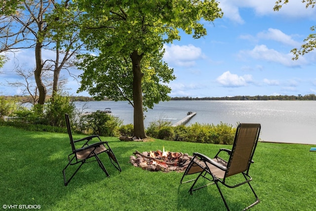 1046 N Hainesville Rd, Round Lake Beach, IL 60073 - view of green lawn with a fire pit and a water view