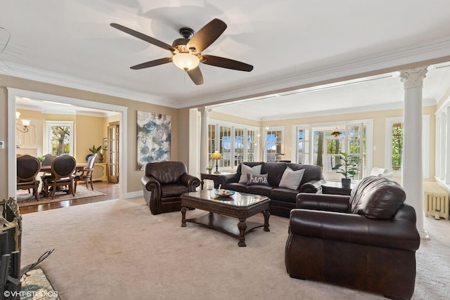 1046 N Hainesville Rd, Round Lake Beach, IL 60073 - living room featuring crown molding, decorative columns, radiator heating unit, plenty of natural light, and a ceiling fan