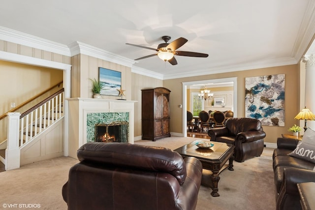 1046 N Hainesville Rd, Round Lake Beach, IL 60073 - carpeted living room with crown molding, ceiling fan, a chandelier, stairs, and a high end fireplace