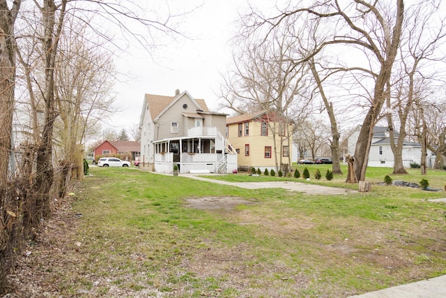 732 N Dearborn Ave, Kankakee, IL 60901 - view of front of house with a sunroom, a front yard, and a residential view