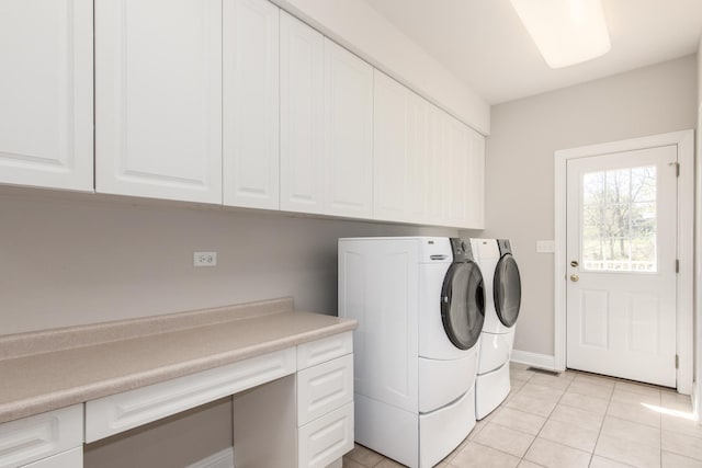6433 Davidson Ct, Gurnee, IL 60031 - laundry room featuring independent washer and dryer, cabinet space, light tile patterned floors, and baseboards