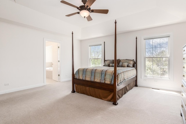 6433 Davidson Ct, Gurnee, IL 60031 - bedroom with light colored carpet, baseboards, ensuite bath, and a ceiling fan