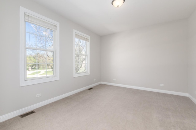 6433 Davidson Ct, Gurnee, IL 60031 - empty room featuring light colored carpet and baseboards