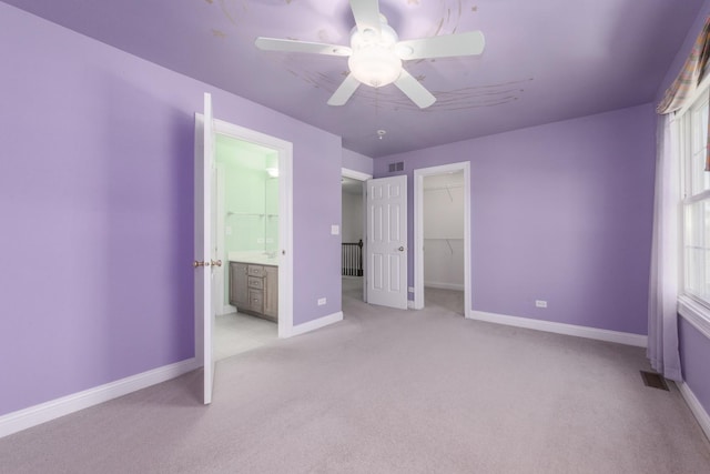6433 Davidson Ct, Gurnee, IL 60031 - unfurnished bedroom featuring light carpet, baseboards, ensuite bath, and multiple windows