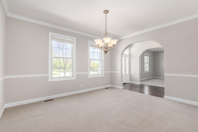 6433 Davidson Ct, Gurnee, IL 60031 - carpeted spare room featuring a chandelier, plenty of natural light, crown molding, and baseboards