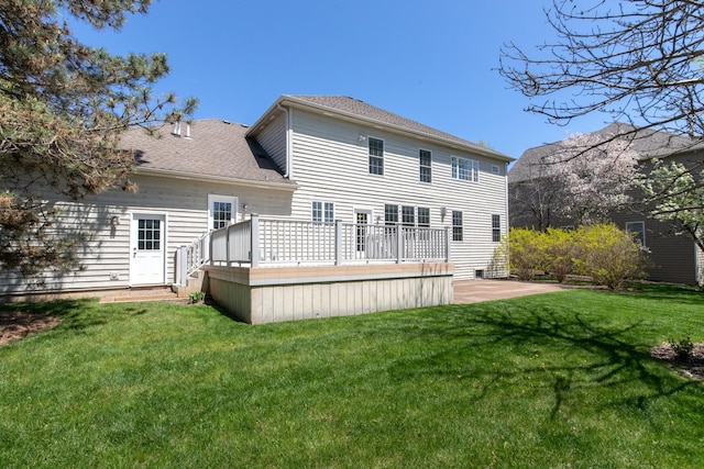 6433 Davidson Ct, Gurnee, IL 60031 - rear view of house with a deck, a yard, and a shingled roof