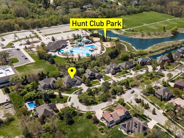 6433 Davidson Ct, Gurnee, IL 60031 - aerial view of property and surrounding area featuring a pool area, a large body of water, and nearby suburban area