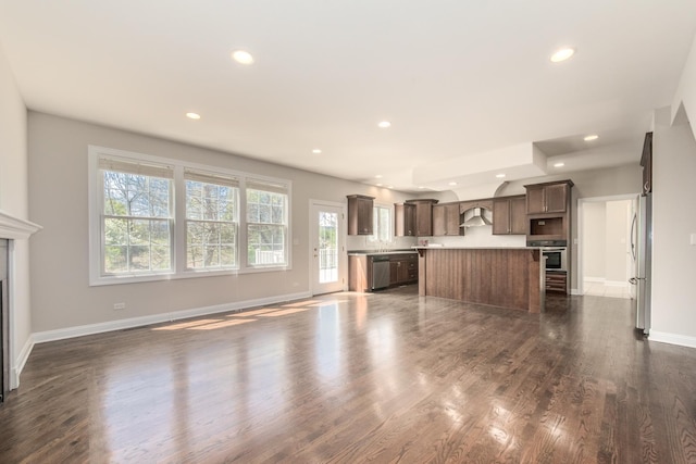 6433 Davidson Ct, Gurnee, IL 60031 - unfurnished living room featuring recessed lighting, baseboards, dark wood-style floors, and a glass covered fireplace
