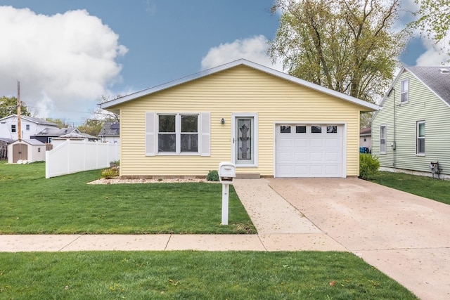 view of front of property with concrete driveway, an attached garage, and a front lawn